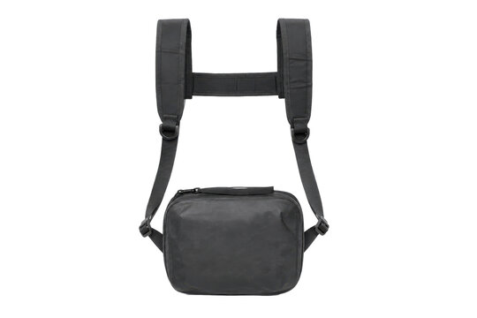 Black tactical chest bag with shoulder straps and a front zipper, photographed on a clean white background