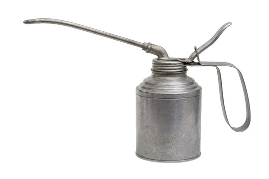 Old vintage metal oil can with a long spout and handle, showing signs of wear on a white background