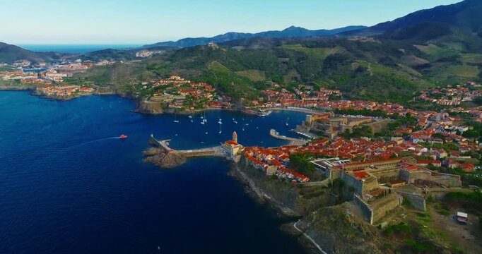 Aerial view of the beautiful, picturesque village of Collioure on the Mediterranean coast, featuring the lovely Fort Saint Elme by the sea, France, near the city of Perpignan.