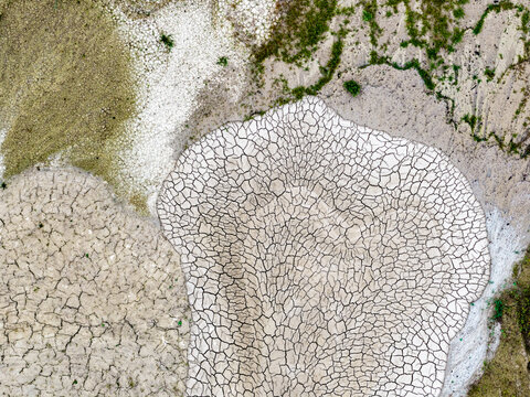 Aerial view of the cracked, dry earth patterns at the Tagebau Hambach open-pit mine in Elsdorf, Nordrhein-Westfalen, Germany.