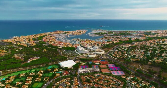 Aerial view of picturesque Mediterranean marina in the town of Agde, featuring sailing yachts. A popular seaside resort in the south of France, known for its sandy beaches, yachting