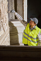 Surveyor captures images of wall flaws for restoration planning © diczman