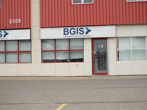 Gloucester, Ontario, Canada &ndash; July 31, 2026: The "BGIS Integrated Technical Services" storefront sign is displayed above a glass door on a red metal industrial building at 5509 Canotek Rd Unit 4. 