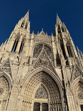 Ornate Gothic church facade beneath a clear blue sky