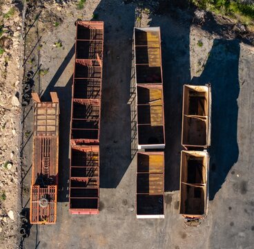 Aerial view of empty truck load bins arranged in a yard, showing industrial steel frames and transport capacity in Ladismith, Western Cape, South Africa.