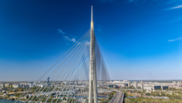 Aerial view of the Ada Bridge with its distinctive pylon and cable-stayed design spanning the Sava River in Beograd, Grad Beograd, Serbia.