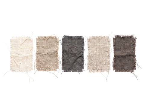 Linen fabric swatches canvas samples in neutral earth tones arranged horizontally on black background with frayed raw edges and textured coarse weaving for interior design moodboards and mockups.