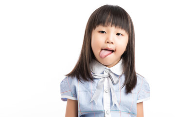 Playful little Asian girl sticking her tongue out, making a funny face, white background. © Li Liu