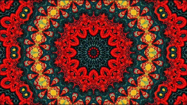 ​A seamless 4K motion loop featuring an intricate geometric kaleidoscope mandala pattern with vibrant red, teal, and yellow tones, ideal for dynamic backgrounds and surface design.  