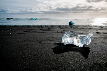 Glacial Ice Block on Black Sand at Diamond Beach Iceland © Jennifer