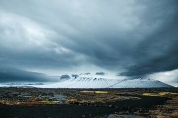 Hverfjall Volcanic Crater Covered in Snow Under Dark Stormy Sky © Jennifer