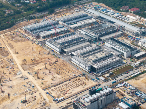 Gelang Patah, Johor, Malaysia - 31 March 2026: Aerial view of NTP Nusajaya Tech Park showing ongoing industrial construction with heavy machinery, cranes, and large factory buildings.