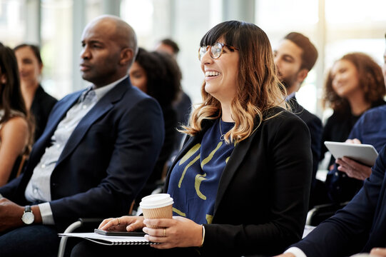 Woman, laugh and business people with conference, audience or announcement for seminar event. Workshop, information and comedy with crowd, sales proposal and b2b support for presentation or pitch