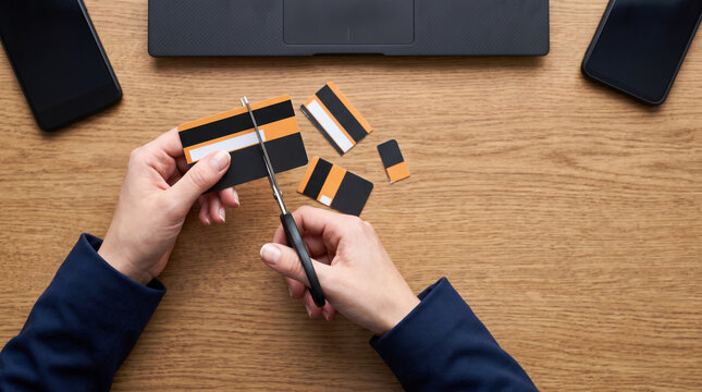 Hand scissors cut card for credit payment. Finance crisis recession problem. bankruptcy bankrupt destroy loss, debt loan pay spending poverty