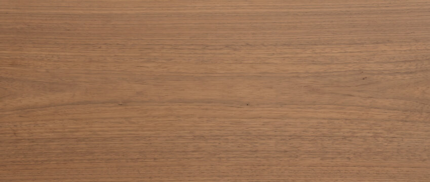 Warm brown walnut wood grain texture with fine parallel lines for a smooth natural furniture background design