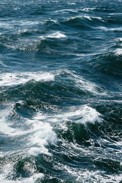 Choppy ocean waves with white foam