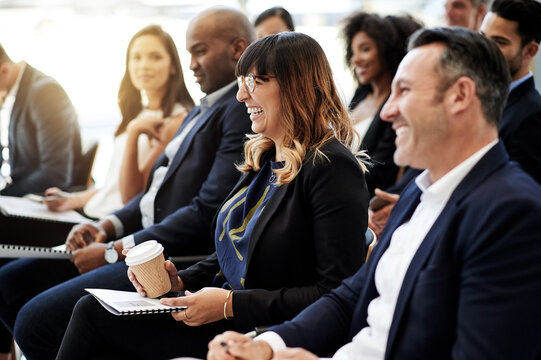 Presentation, business or audience with happy woman for laughing, workshop or education. Smile, learn or speech in conference with crowd, people or funny joke for event, corporate class or listening