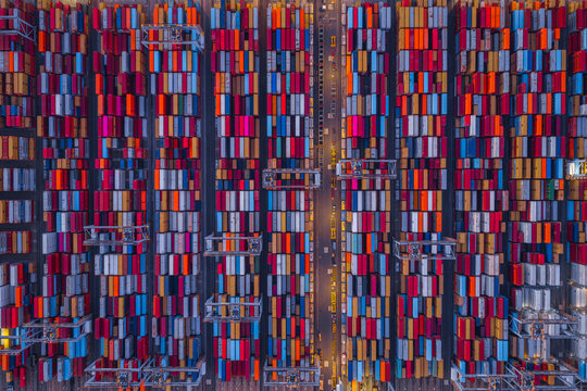 Corringham, United Kingdom - 25 September 2026: Aerial view of London Gateway container terminal with rows of colorful shipping containers and gantry cranes.