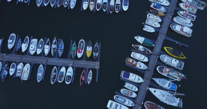 Rows of boats at a marina seen straight down, Faroe Islands