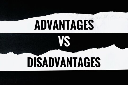 Two torn strips of white paper showing the text "ADVANTAGES VS DISADVANTAGES" on a black background.