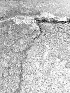 Black and White Weathered Concrete Texture with Cracks, Rough Surface, Distressed Details and Grunge Industrial Background.
Monochrome Cracked Concrete Wall Texture with Rough Cement Surface.