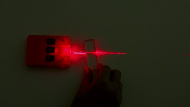 Red Laser Beam Refraction Physics Experiment with Glass Block