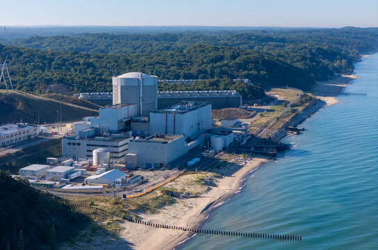 Covert, Michigan, United States - 28 September 2026: Aerial view of Palisades Power Plant on the Lake Michigan shoreline, surrounded by dense forest and industrial infrastructure.