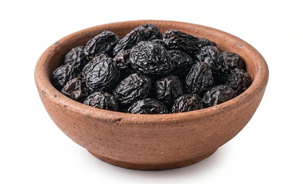 Dried plums in rustic terracotta bowl isolated on white background