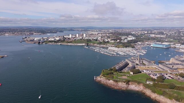 Aerial view of the Plymouth estuary and cityscape with boats, historic buildings, and coastal scenery in Plymouth, England, United Kingdom.