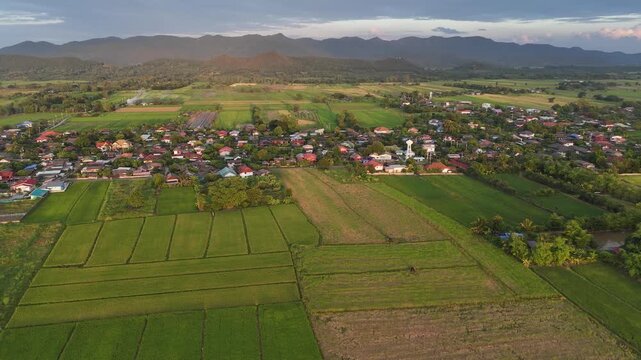 Aerial view of the countryside village in Pa Daet district one of the southern part of Chiang Rai province of Thailand at sunset.
