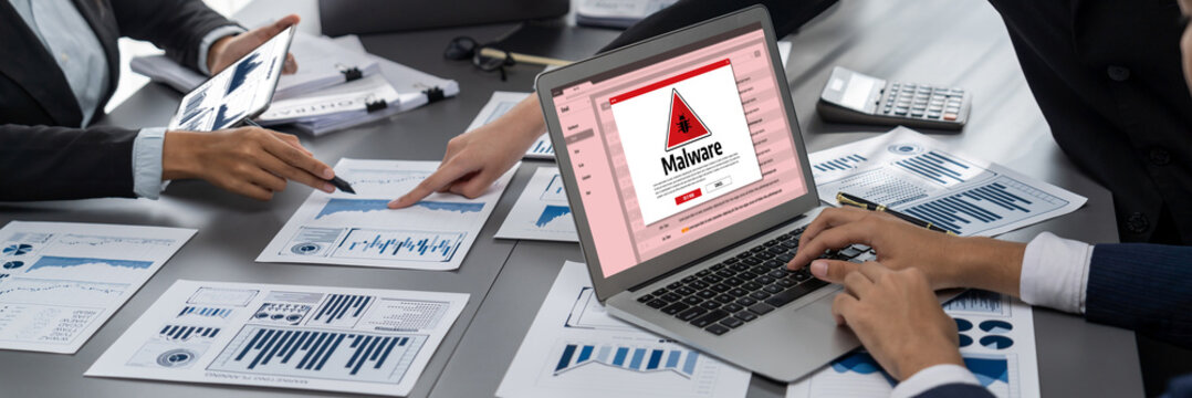 Cyber attacking concept. Malware alert showing on computer screen display scam and threat detection on computer system or online server to be removed brisk.