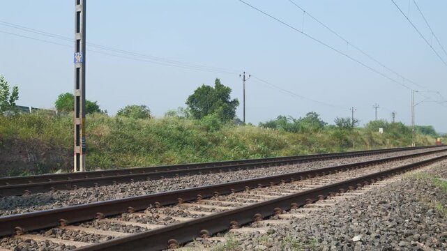 Passenger train hauled by a WAP7 electric locomotive near Pune India.