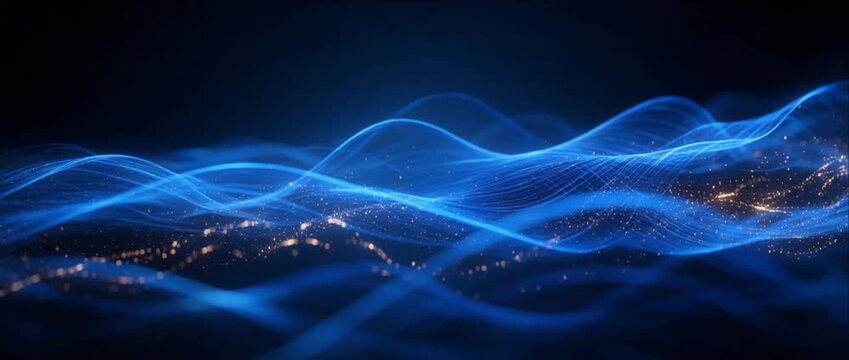 Glowing blue particle waves flowing across dark abstract digital background, creating sparkling energy light trails for futuristic technology design, motion graphics, and luminous visual effects