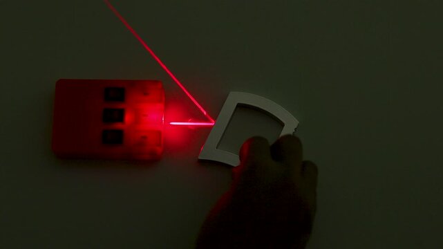 Physics Optics Experiment with Red Laser Beam and Curved Mirror