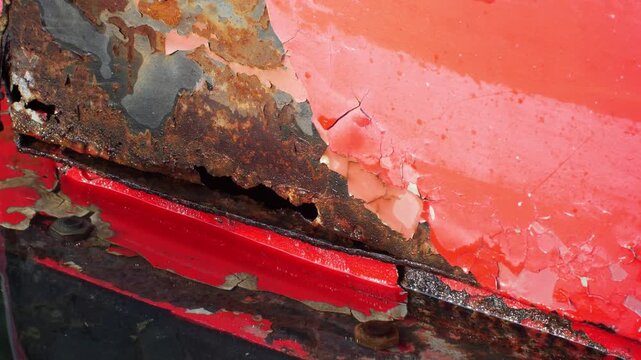 Weathered Red Metal Surface with Peeling Paint and Rust Reflected in Dark Water, Abstract Decay