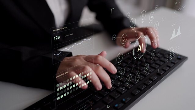 A person types on a keyboard. Learning, content and research functions connect through an AI hub, with monitoring providing visibility into resources and the movement of information.