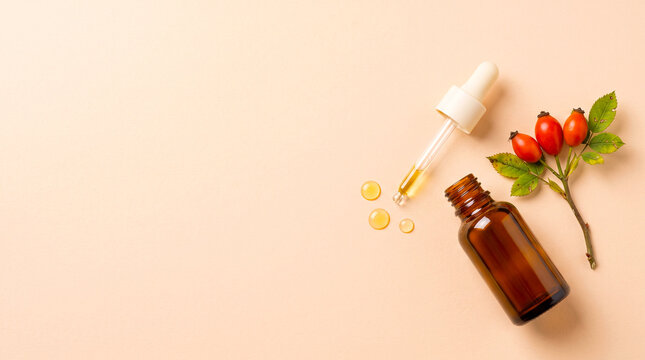 Amber Serum Bottle with Rosehips and Golden Oil Drops