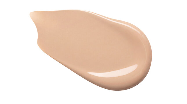 Creamy liquid foundation swatch, beige makeup concealer smear on white, smooth cosmetic skin tone cream stroke