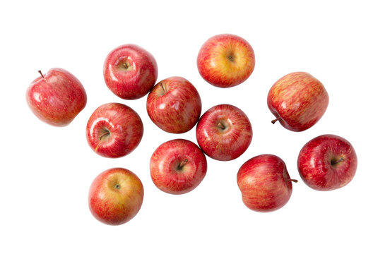 Red apples scattered on transparent background, top view