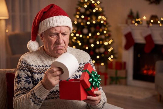 Elderly Man Wearing Santa Hat Unboxing Funny Disappointing Christmas Gift