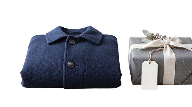 Folded blue wool winter jacket next to wrapped gift box