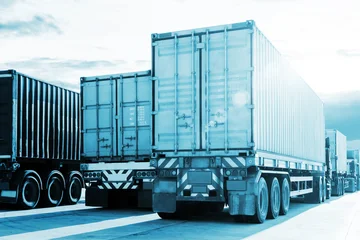 Row of Semi Trailer Trucks on The Parking Lot. Freight Transportation Logistics Truck. Container Terminal at Warehouse Port. Shipping Cargo Container. Distribution Warehouse.   © Siwakorn1933