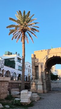 Arch of Marcus Aurelius beside historic buildings in Tripoli's Medina, Libya