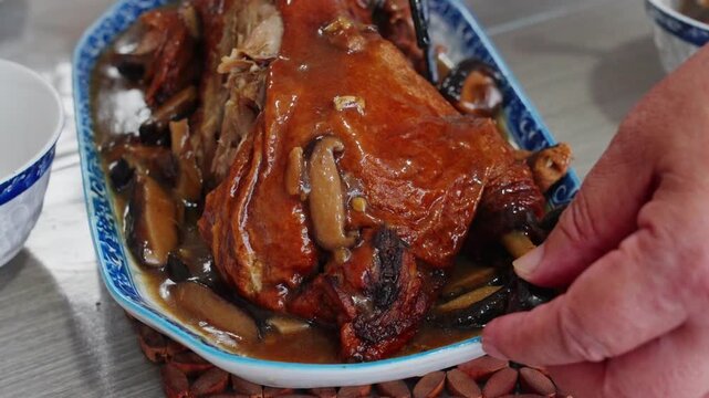 Drunken Duck with Shiitake Mushrooms on the plate and served as a traditional Nanning home-cooked dish