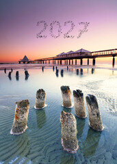Fototapeta premium A New Journey Begins – 2027 in the Sky Above a Romantic Beach at Sunset