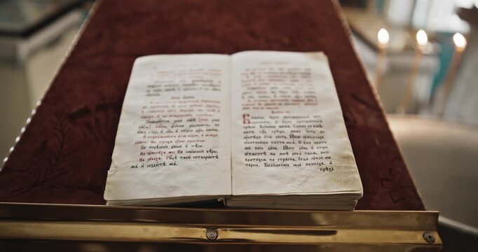 Open Orthodox Liturgical Book Resting on a Red Velvet Lectern