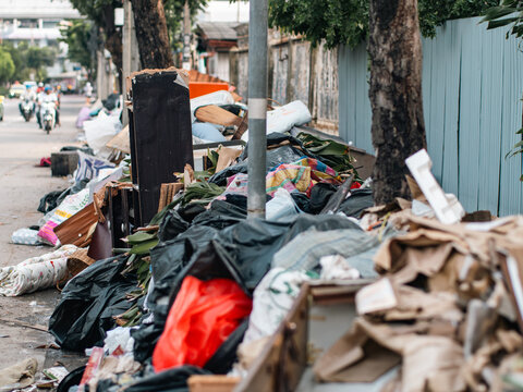 Pile of Discarded Furniture and Household Waste on City Sidewalk, Bulk Trash Collection Day