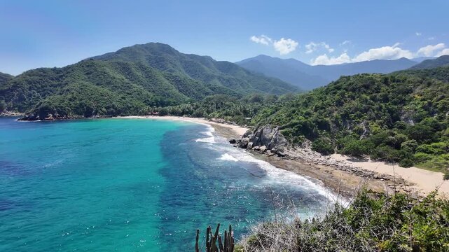 Cliff-side turquoise cove with beach on Venezuela's Caribbean coast