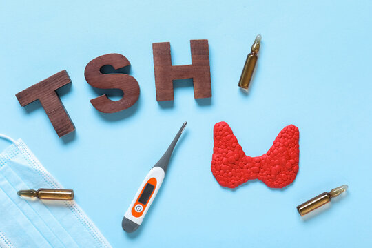 Thyroid health and TSH hormone testing, medical diagnosis of endocrine system disorders with medication and clinical equipment on a blue background