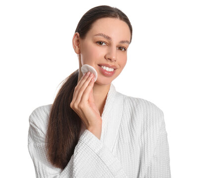 Skincare routine and facial cleansing, young woman using cotton pad for makeup removal in white bathrobe for daily beauty and wellness self care